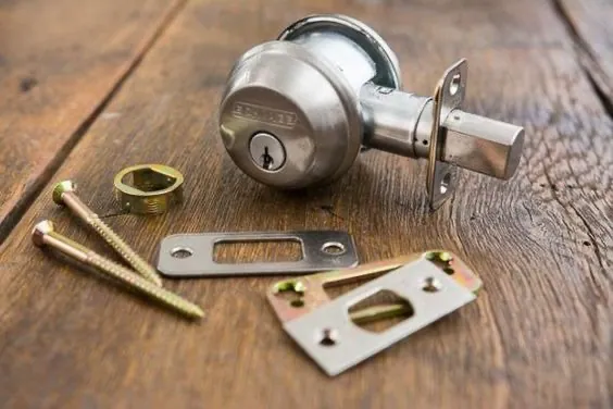 Deadbolt lock hardware prepared for installation by 3 Locksmiths